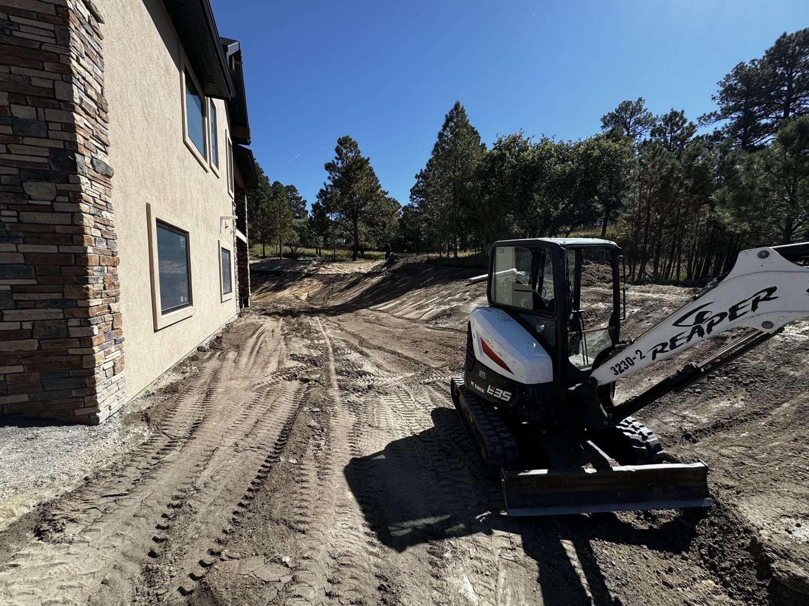 Reaper Siteworks skid steer working a large-format Aurora, Colorado site