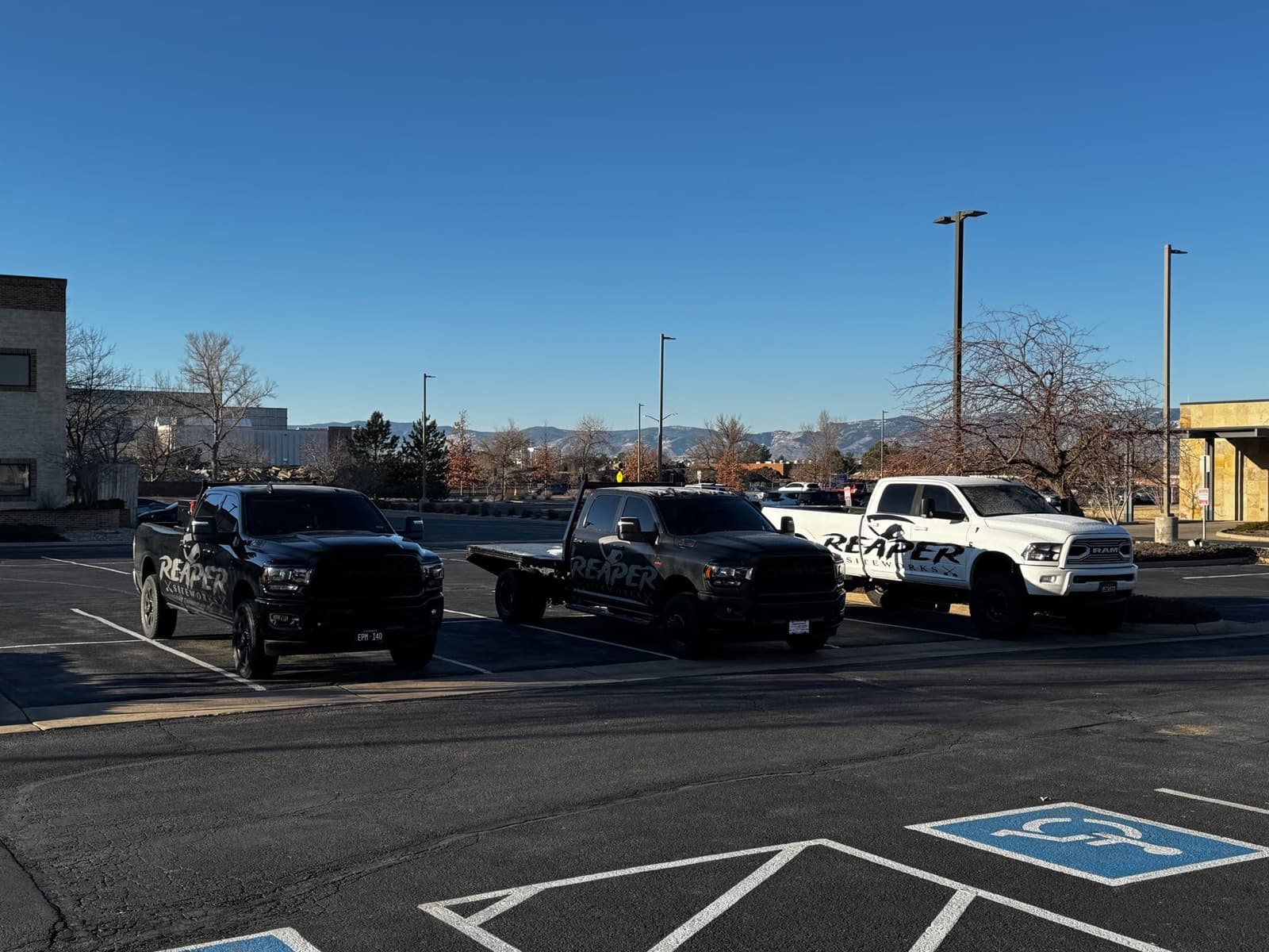 Reaper Siteworks truck fleet staged for a Littleton, Colorado sitework project